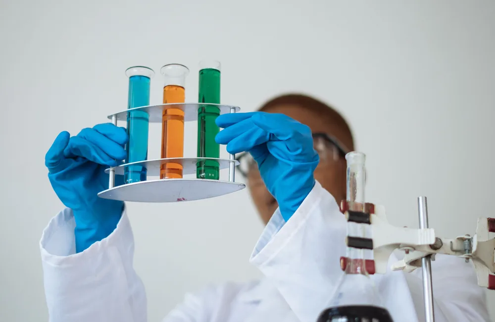 Scientist examining laboratory samples to define testing requirements