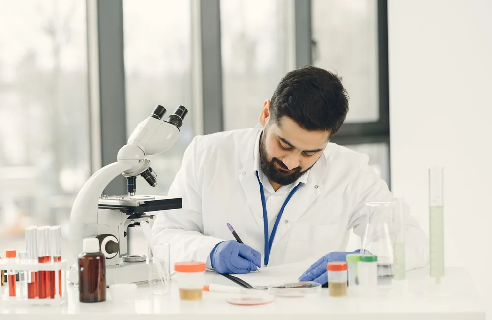Laboratory professional documenting an application requirement